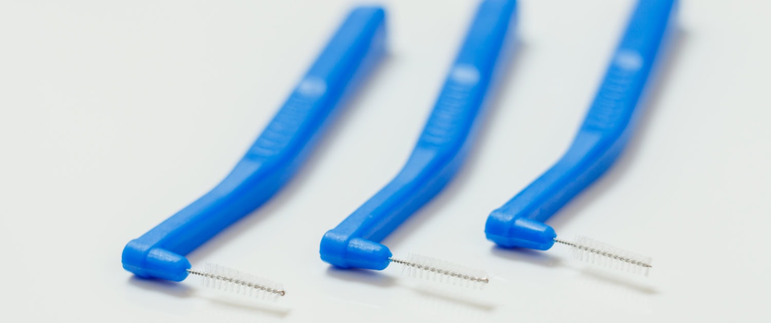 Close-up interdental brushes on white background